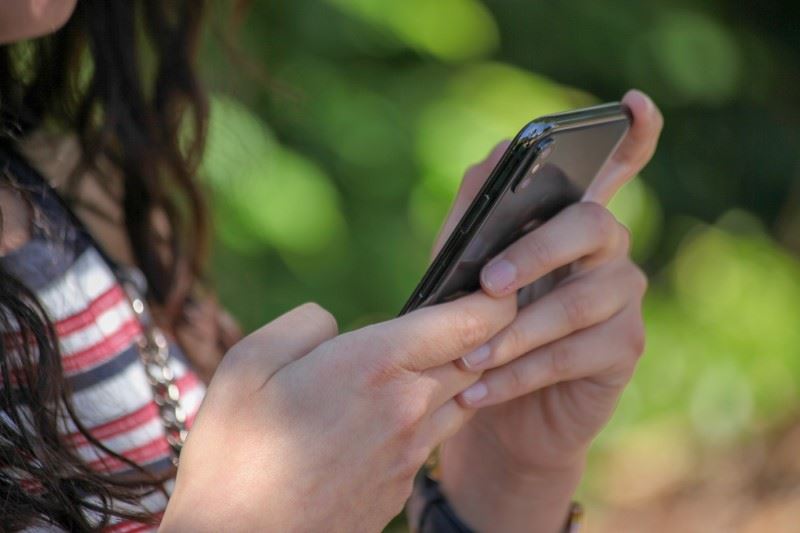 Girl texting on mobile phone